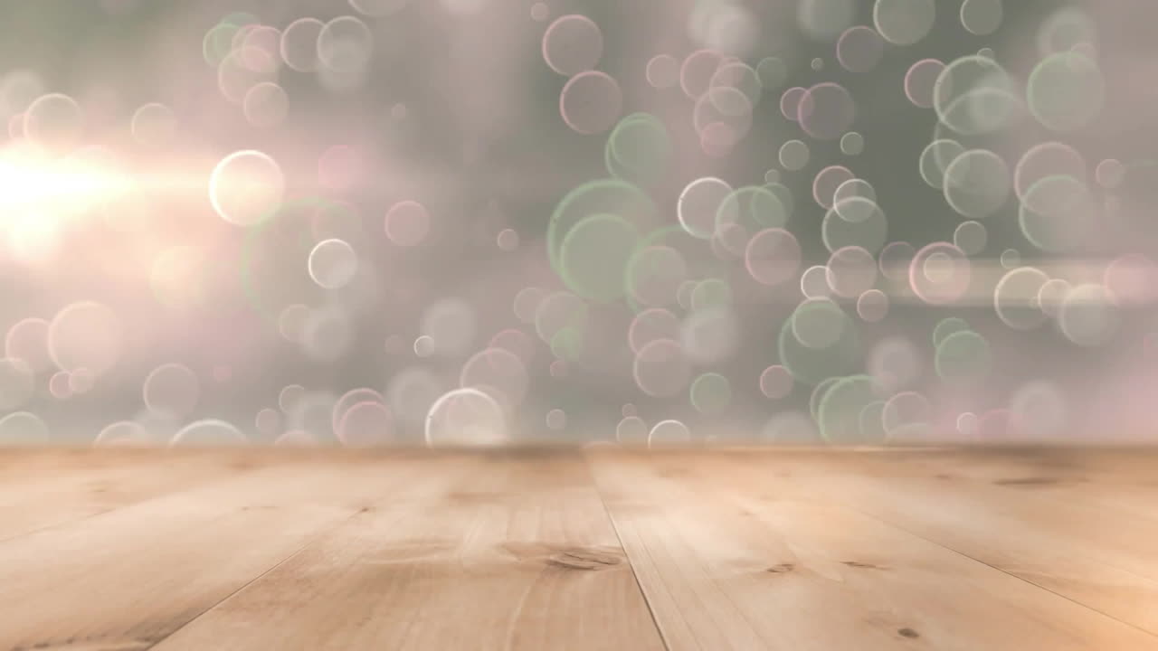 Animation of light spots on grey and wooden background