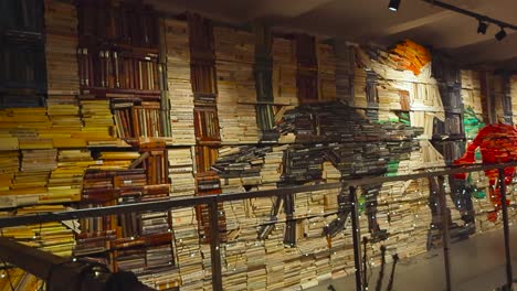 footage of an artistic library book shelf in tallinn at a place called read where books are arranged as wolves chasing each other in the woods. shelves are packed with educational vintage old books.