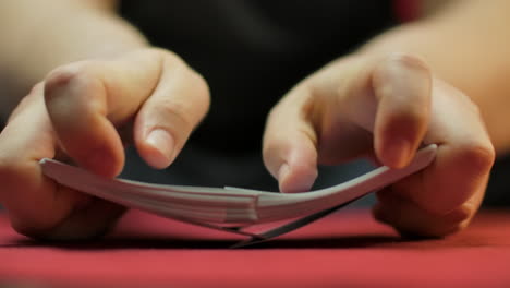 Slow-motion-closeup-of-hands-shuffling-a-deck-of-cards