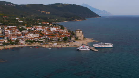aerial footage of ouranoupoli village on the coastline in athos in halkidiki during sunny day