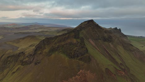 aerial view of a rugged mountain ridge near hafursey, iceland, showcasing volcanic slopes, erosion patterns, and dramatic landscapes.