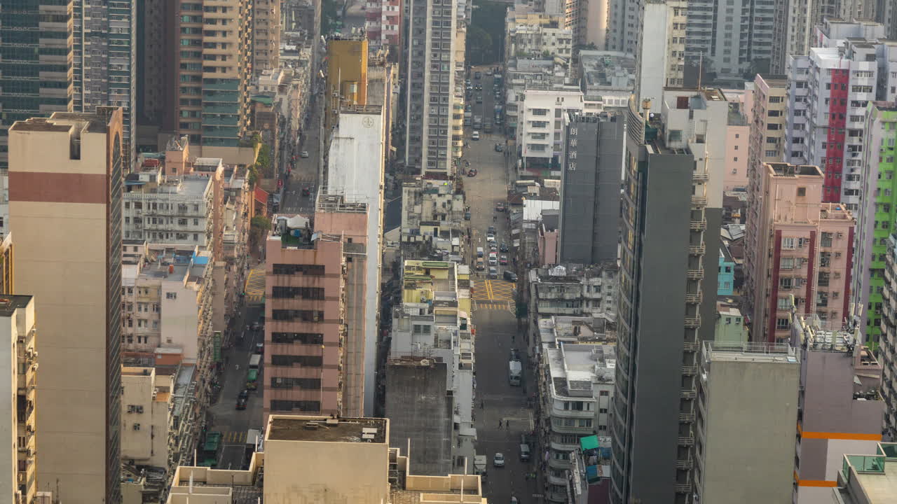 HONG KONG - 19 MARCH 2025 : Timelapse of the Hong Kong kowloon skyline from a high vantage point