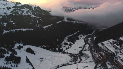 Aerial,-empty-ski-resort-with-no-people-in-mountain-valley-during-COVID-19-pandemic