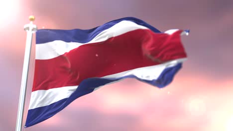 la bandera de costa rica agitando el viento al atardecer, bucle