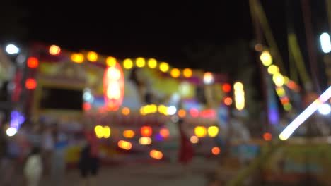 amusement park at night, colorful light of modern attractions.