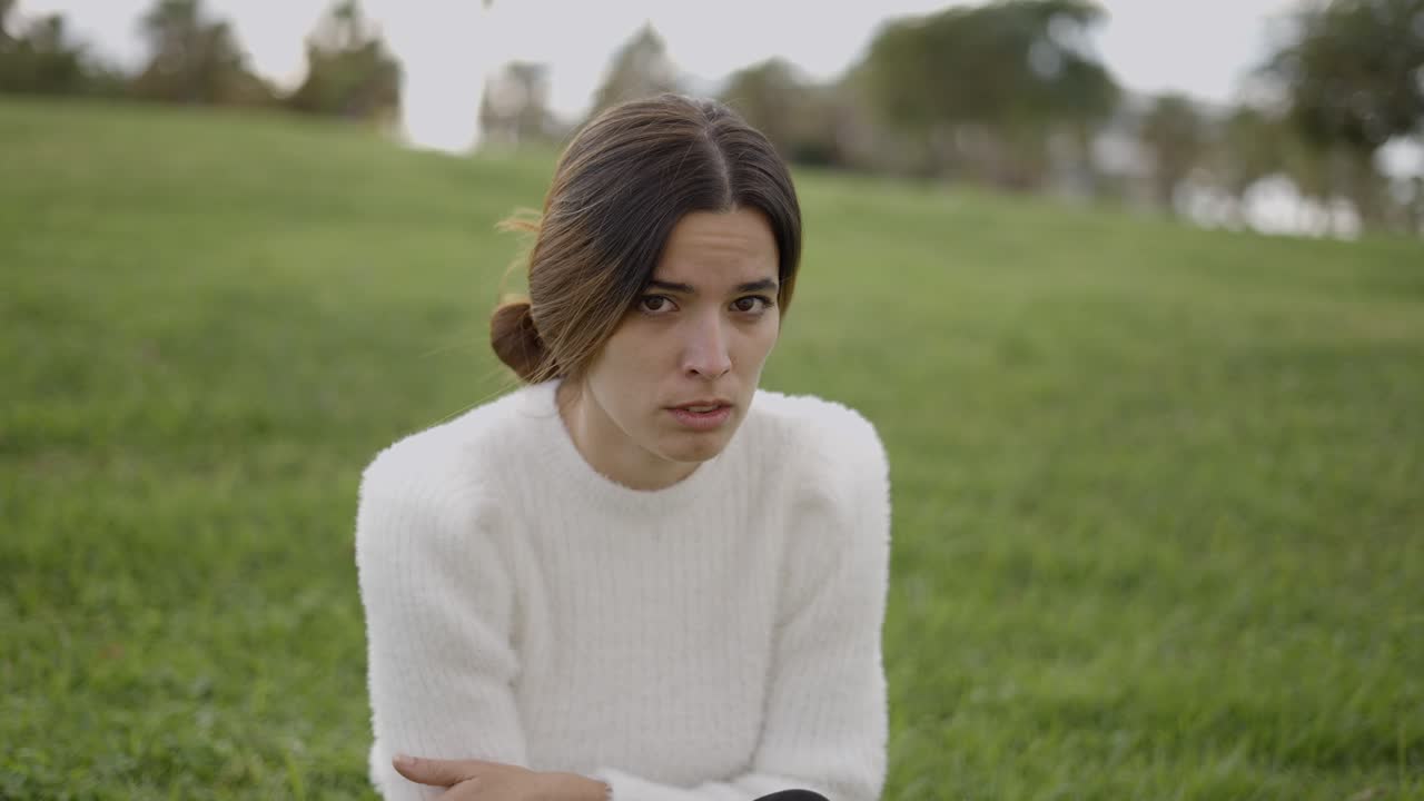 Woman expressing concern in a park