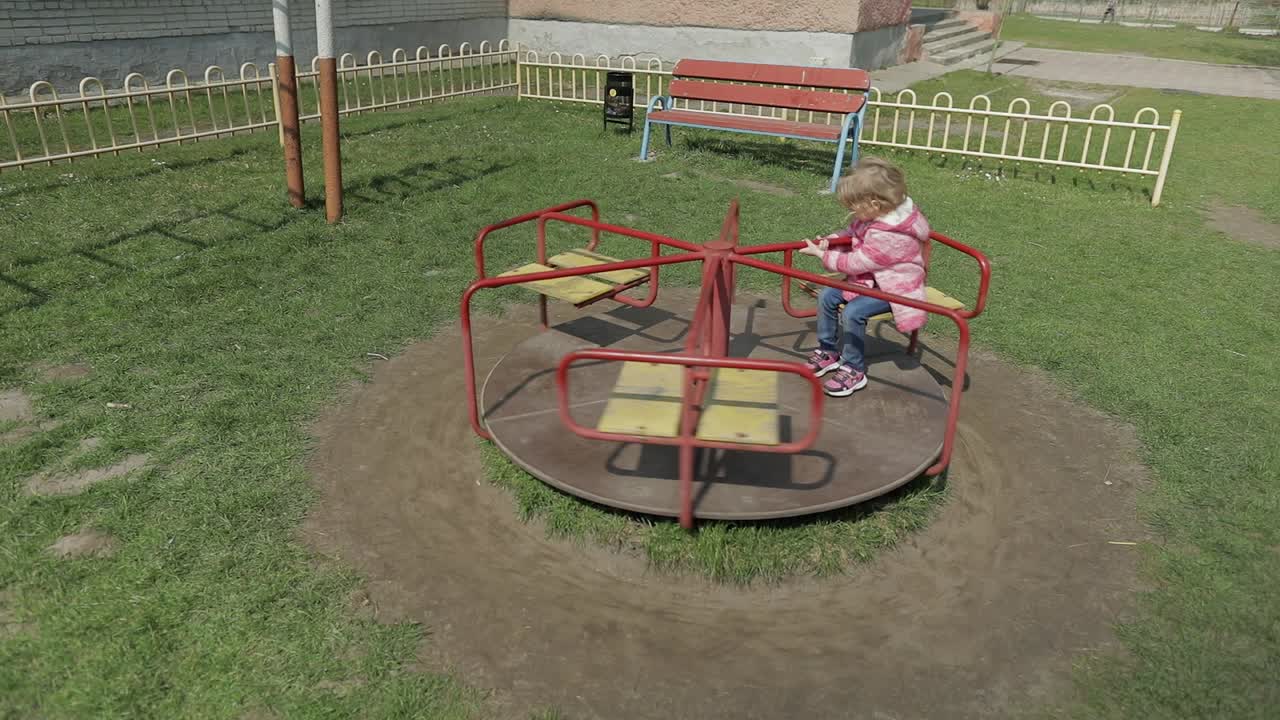 Funny cute girl is playing. Joyous female child having fun on playground