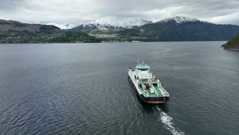 ferry named volda is heading for stranda village in more and romsdal norway - aerial following ship