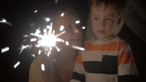 elder sister and little brother watching a bengale fire