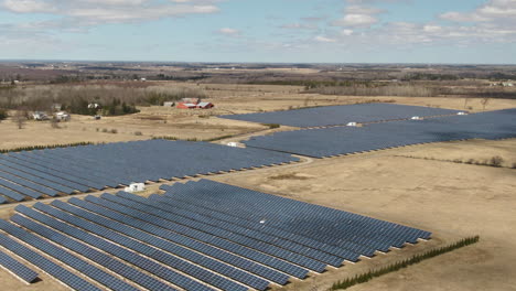 Neat-rows-of-solar-panels-on-a-solar-farm-filmed-from-the-drone