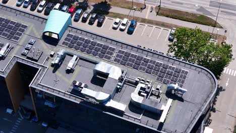 solar panels on top of kauno dokas building, aerial orbit view