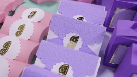 handmade gift boxes with candy in pink and violet color, paper crafts