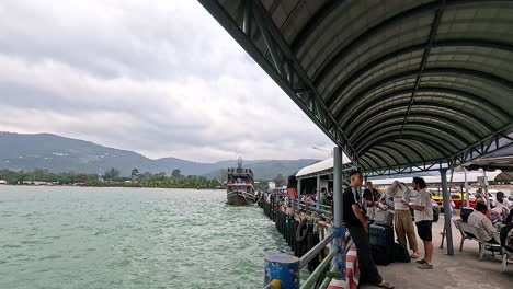 ferry terminal at a tropical port with people