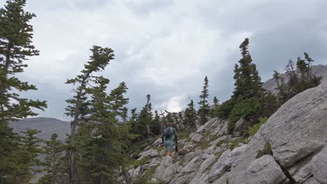 hiker walking up mountain revealed rockies kananaskis alberta canada