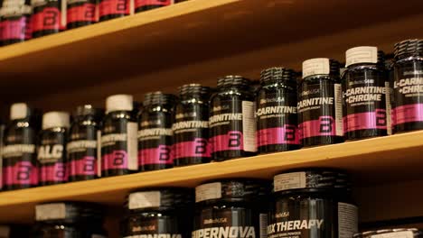 sport nutrition store interior with large choice of nutritional supplements.