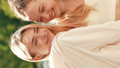 two young women laughing and enjoying each other's company