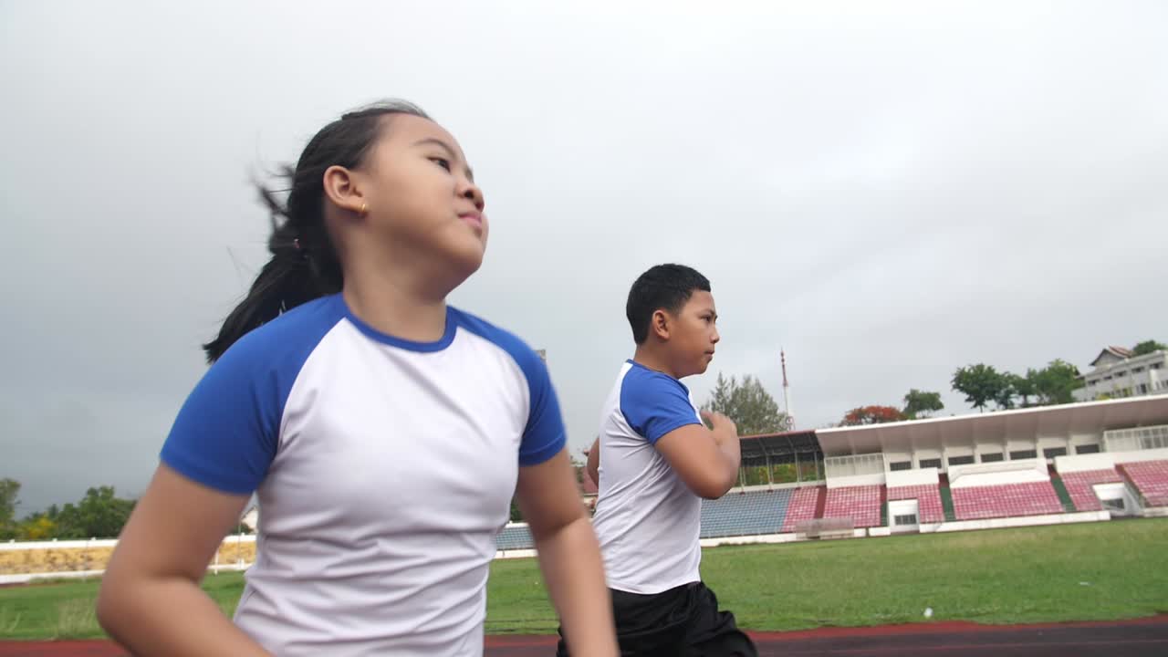Children Running On The Track