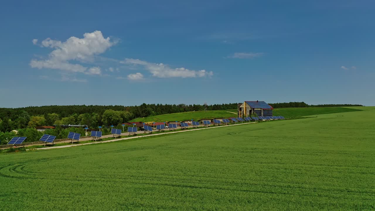 Innovative solar panels on field. Blue sunny batteries collect clean energy from the sun in bright day. Private solar station on green field.