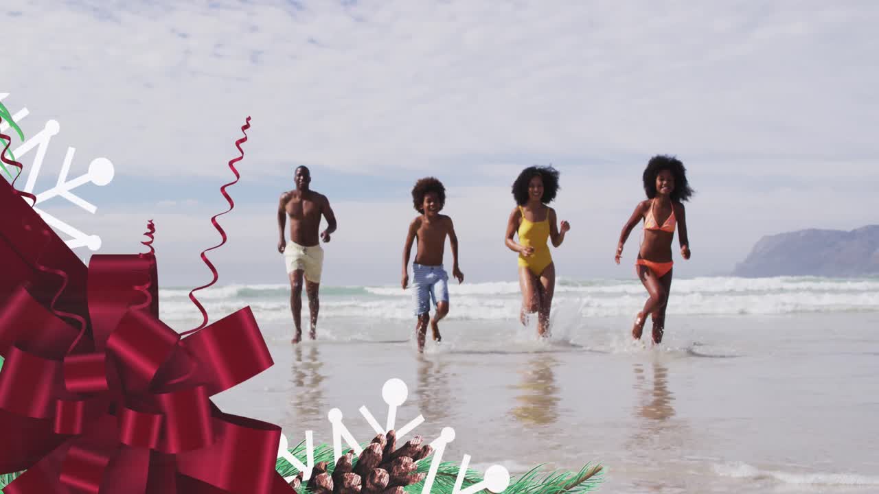 Animazione di fiocco rosso su felice famiglia afroamericana che corre sulla spiaggia