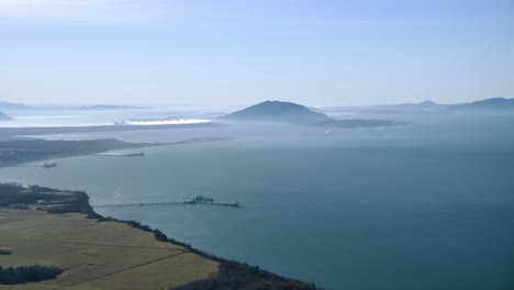 Scenic-Aerial-Shot-of-Pacific-Northwest-Coastline-on-a-Sunny-Day