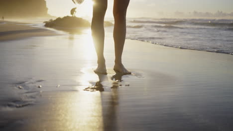 sunrise beach walk with surfboard