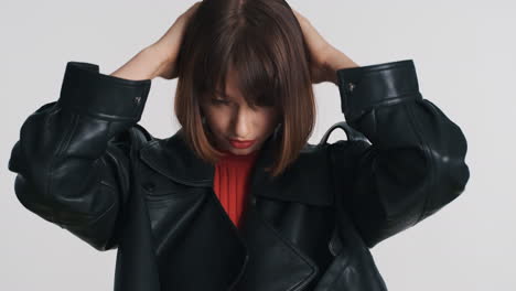 young beautiful woman fixing her hairstyle