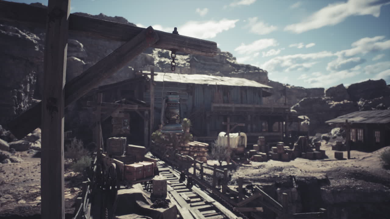 Old mining town with wooden lift and supplies under a bright sky