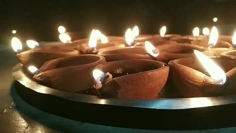 nearby shot of lighting clay diya