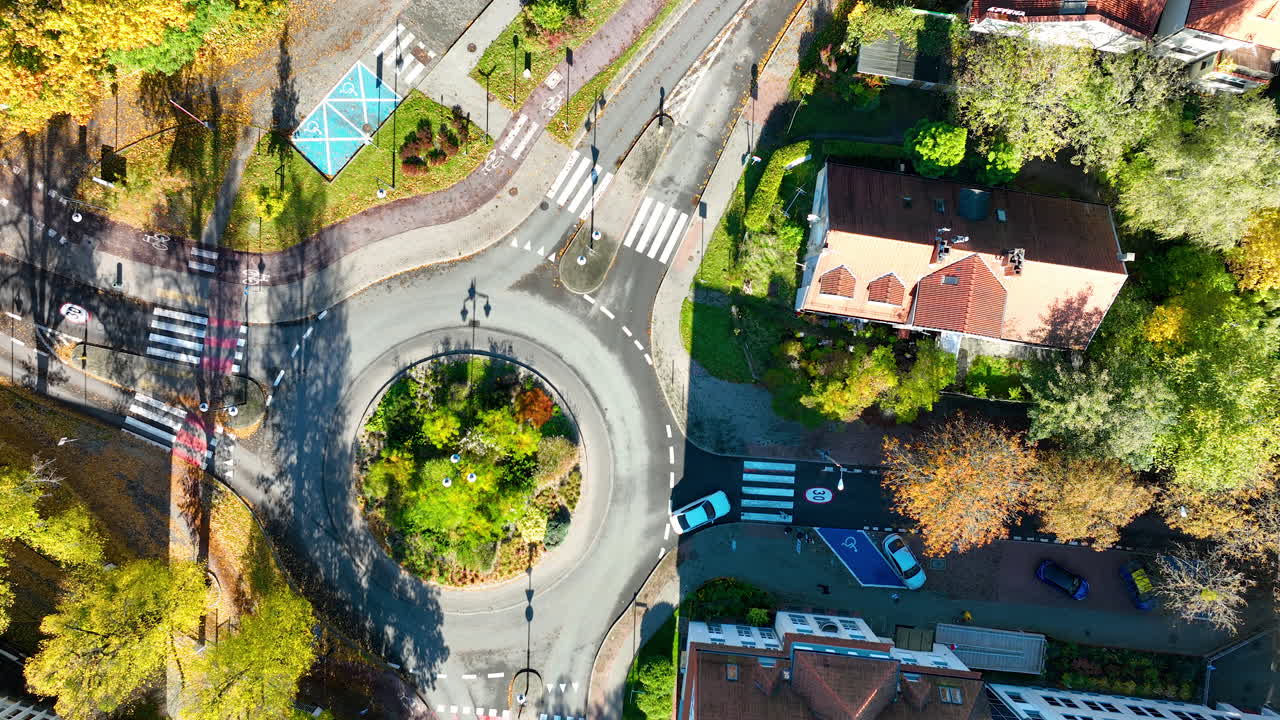 Top-down drone shot of Sopot roundabout with cars and pedestrian crossings