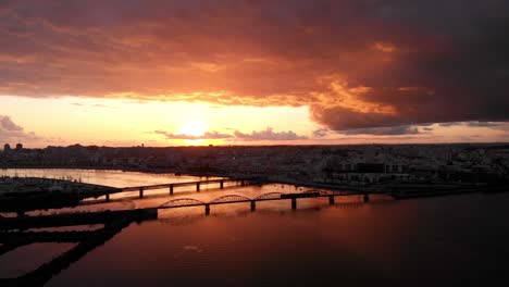 stunning sunset over city bridge and river