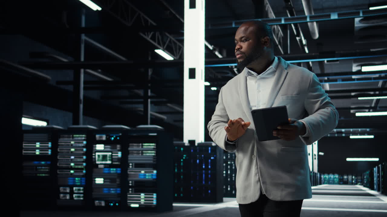 Vertical video Server room admin doing troubleshooting to prevent downtime