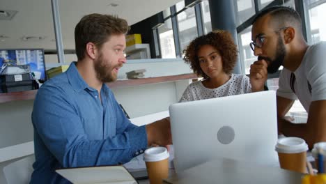 business colleagues discussing over laptop 4k