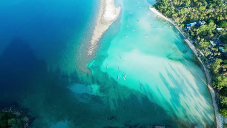 clear water beach in tropical koh pha-ngan thailand's pristine sea shore aerial drone view
