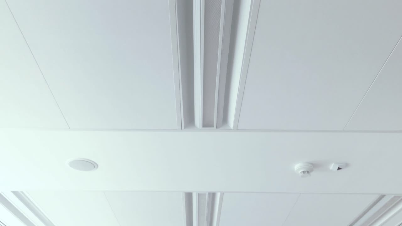 View of bright ceiling with energy-saving lighting, Modern office with white ceiling and nice design