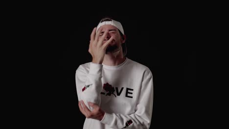 trendy 20s man shaking head giving extreme facepalm, wide, black background