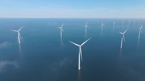 huge windmill turbines, offshore windmill farm in the ocean westermeerwind park , windmills isolated at sea on a beautiful bright day netherlands flevoland noordoostpolder