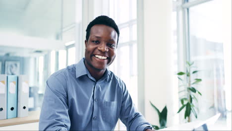 Smile,-face-and-black-man-in-office-at-laptop