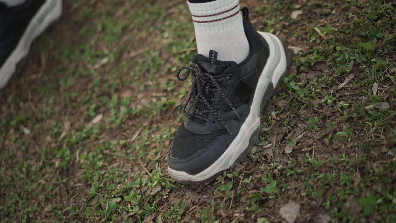 Woman Stretching Outdoors, Caucasian Woman Preparing For Exercise Outdoors, Focused Image Of Woman Warming Up On Grassy Field, An Image Capturing Woman In Midst Of Warmup Routine On Grass Field