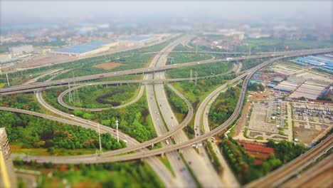 day time wuhan city car and train traffic junction aerial panorama 4k tilt shift china