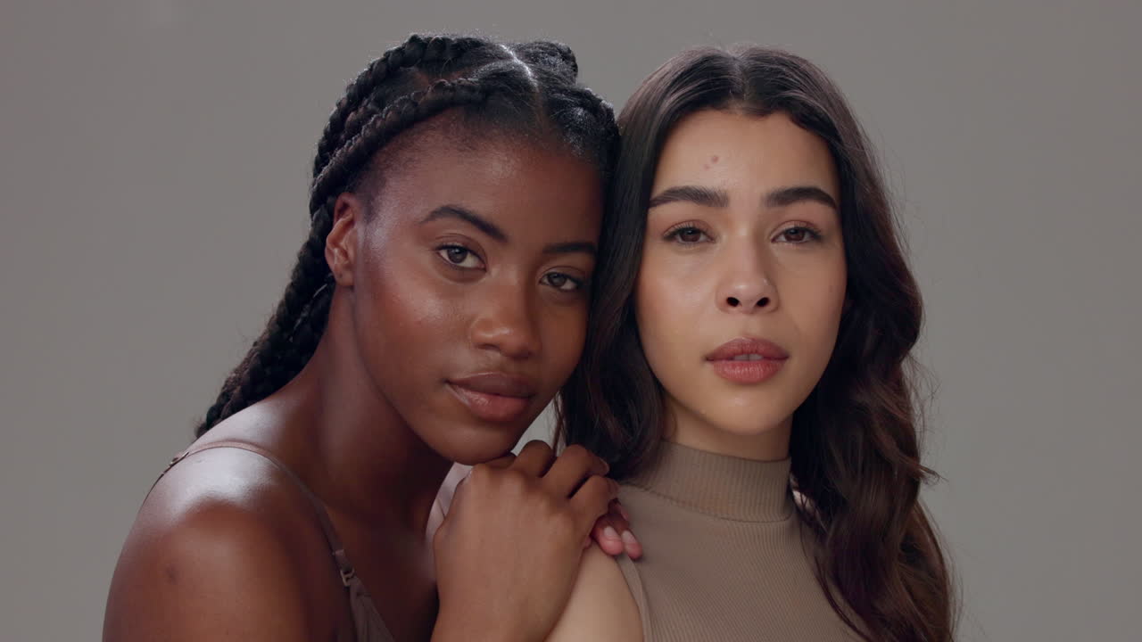Two Women Smiling and Looking at the Camera