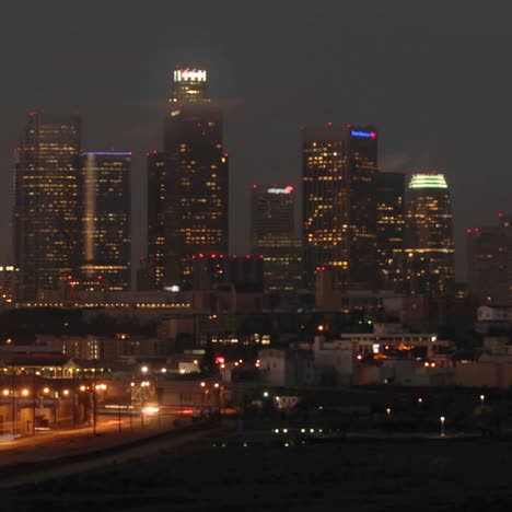 Time-lapse-motion-of-cars-and-train-commuting-into-Los-Angeles-at-dawn-California