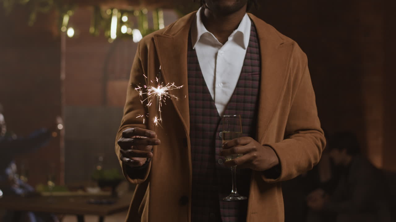 Man celebrating with sparkler