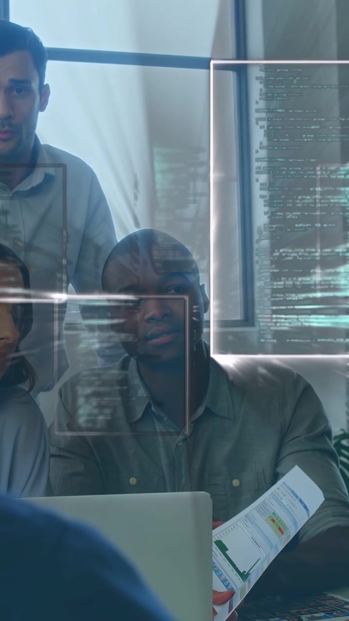 Vertical video: Data team reviewing laptop charts after report for pitch HUD sweeping across papers