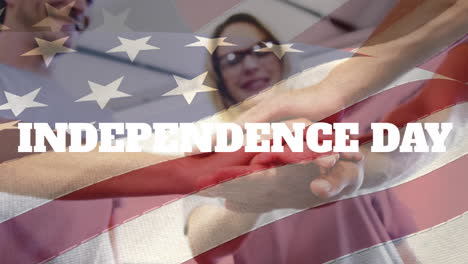 Animation-of-independence-day-text-and-flag-of-america-over-caucasian-friends-stacking-hands