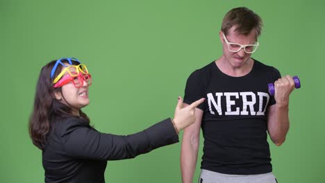 mature asian businesswoman and young scandinavian nerd man together