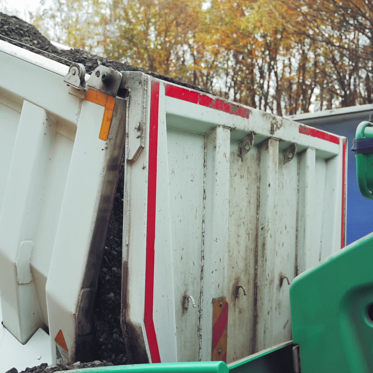 Machine laying asphalt