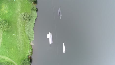 aerial drone shot of waterboard jumps at a watersport park