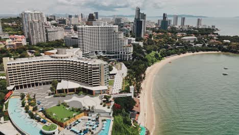 aerial drone footage of pattaya coast with cityscape