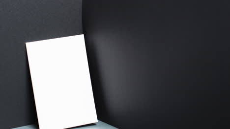 video of book with white blank pages and copy space on black background