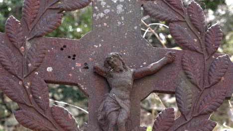 Old-Irish-Famine-graveyard-very-old-metal-cross-marker-on-a-grave-May-in-Ireland